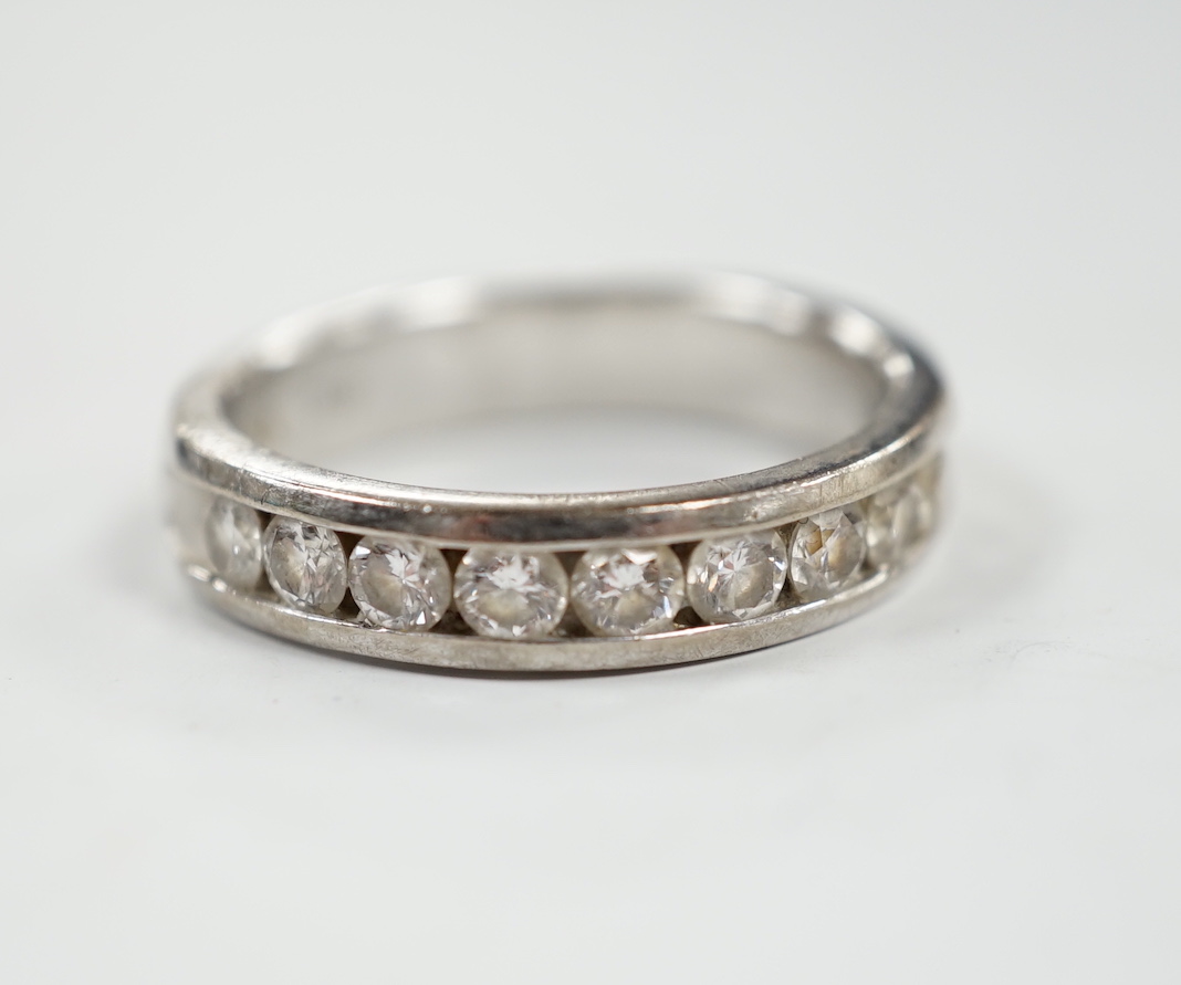 A modern Iliana 18ct white gold and nine stone channel set diamond half eternity ring, size R, gross weight 7.7 grams.